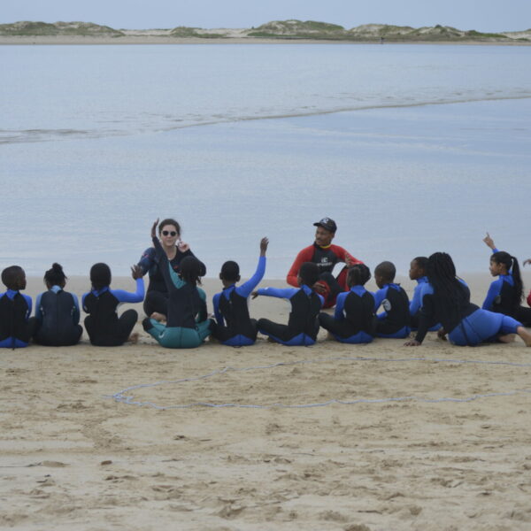The Harmony Project with a group of children on the beach