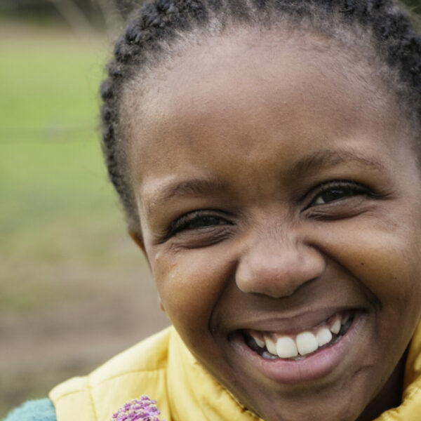 young african girl smiling into the camera